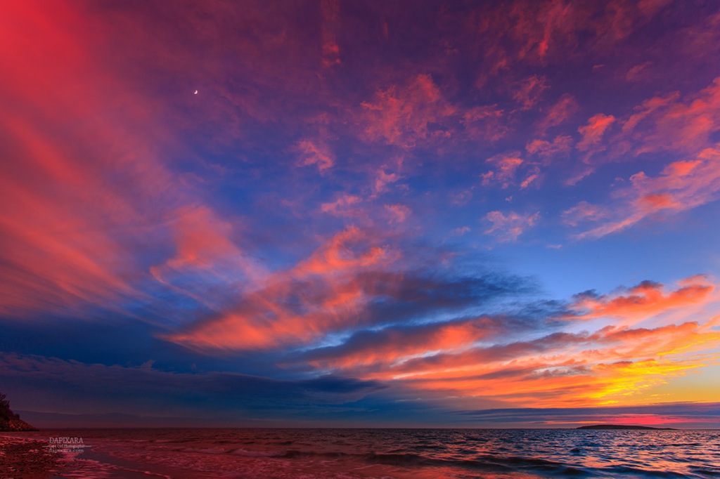 Clouds and moon colored by sunset over Indian Neck beach tonight in Wellfleet, Cape Cod. Photo by Dapixara https://dapixara.com