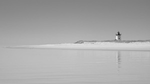 Black and white Isolated Lighthouse. Cape Cod beach, Provincetown, Massachusetts.