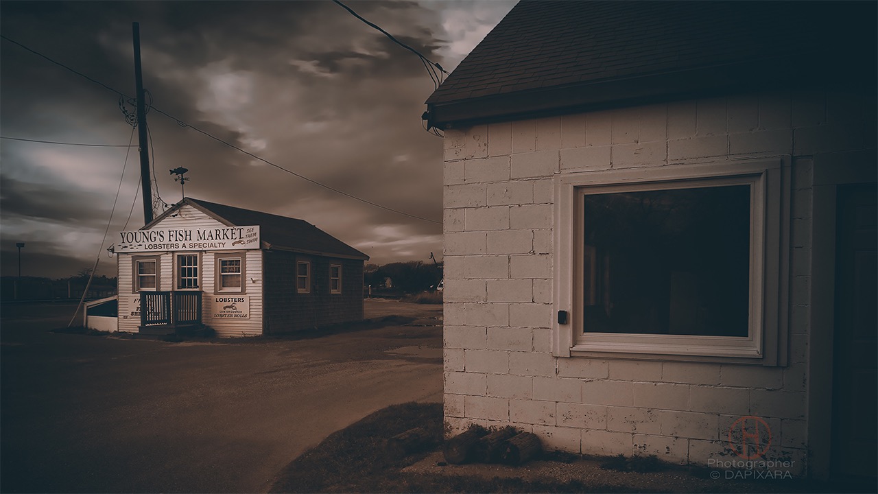 Lobster Shack on Rock Harbor in Cape Cod. Sepia photograph by Dapixara.