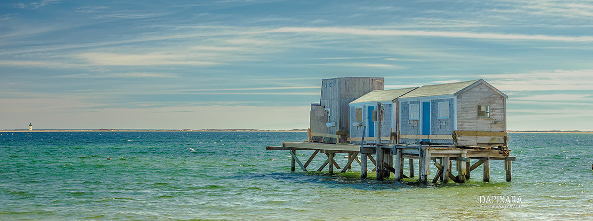 Cape Cod Art: House On The Beach. Panoramic photograph of Provincetown lighthouse. Beach scene prints for sale by photographer Dapixara.