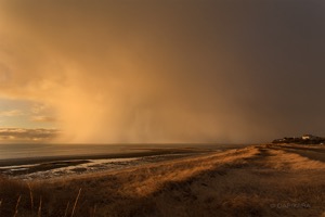 Giant snow cloud touching the Cape Cod bay on Eastham, First Encounter beach. Photographer Dapixara.